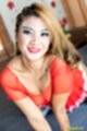 Baifern on all fours leaning forward squeezing her breasts together