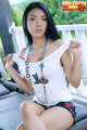 Thumbs in white top legs crossed